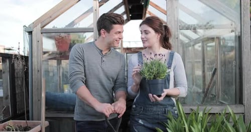Couple Smiling in Garden Greenhouse