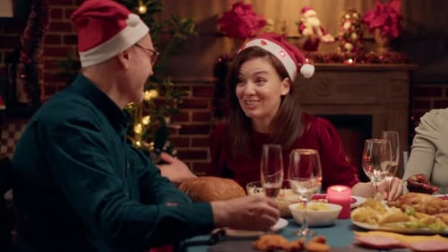 Family Laughing Together at Christmas Dinner