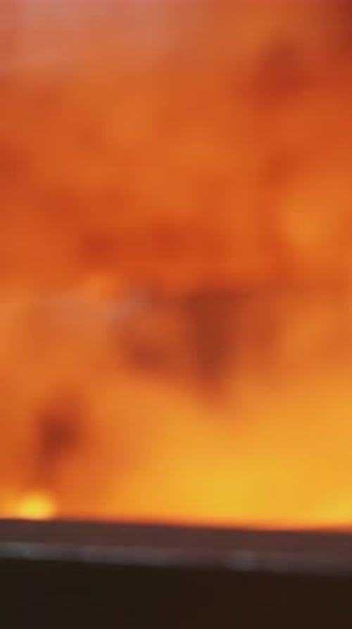 An Engineer Stoker Loads a Flaming Furnace with Coal Stock Clip