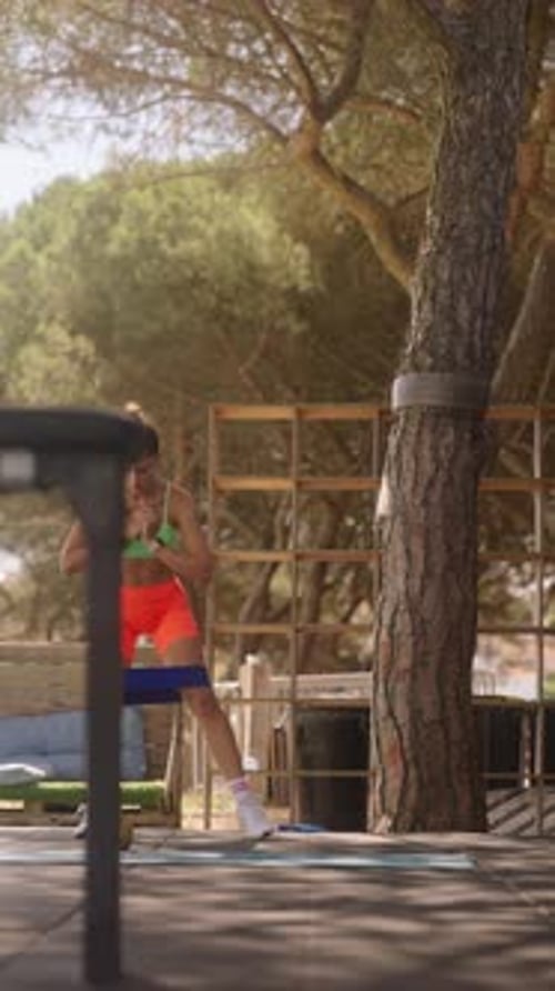 Woman Doing Resistance Band Workout Outdoors