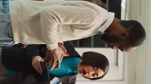 Colleagues Choosing Clothes in an Office Space