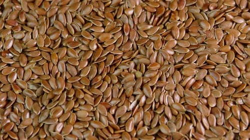 Flax seeds rotating top view close up. Linseed rotate. Healthy nutrition, dieting concepts, tasty