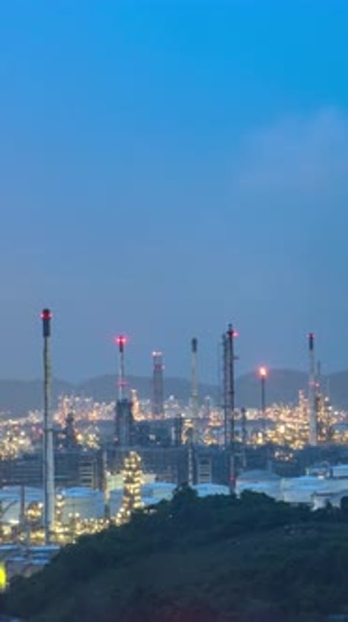Oil refinery facilities time lapse from night to morning.