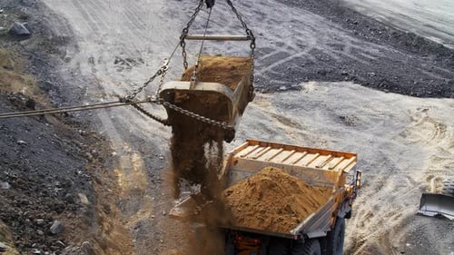 Clam Shell Dumping Dirt into Truck