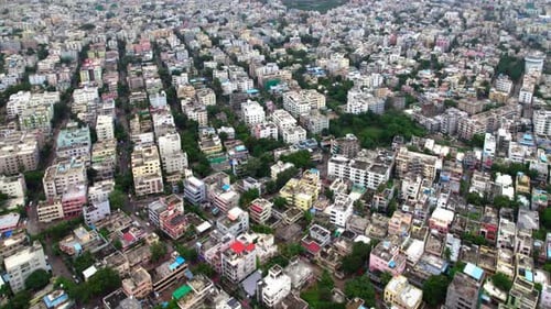 urban residential area filled with apartment complexes, houses, and trees at hyderabad. day time,