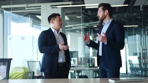 Two Happy Diverse Professional Businessmen Shaking Hands at Office Meeting