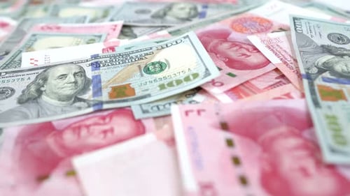 Chinese and American paper money, close up a hand push away cash money on the table, concept idea of