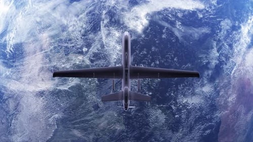 Bomb or missile attacks with unmanned military aircraft.Army Warfare drone in the air over war zone