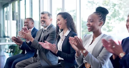 Enthusiastic Group Clapping Hands at Corporate Event