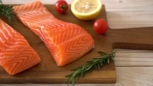 Fresh Salmon Fillets on Cutting Board