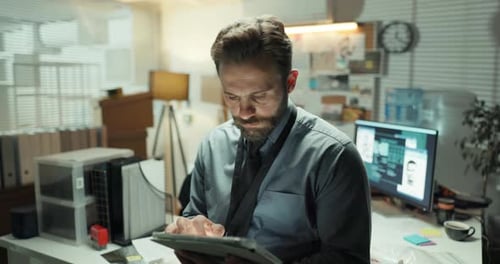 Detective, tablet and reading with man in office for police records, evidence report and night