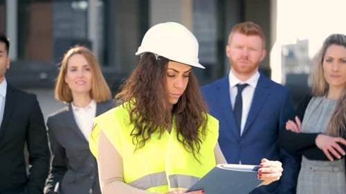 Construction Leader Smiling With Her Team