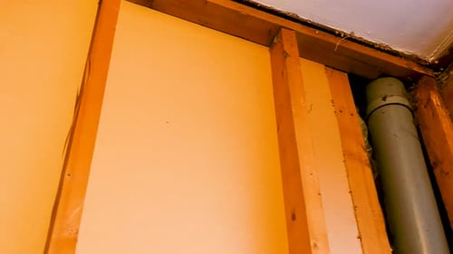 Interior Wall Construction with Pipe and Window