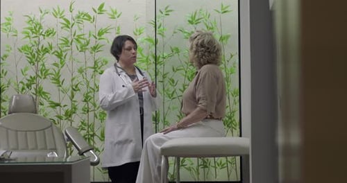 Doctor Consults with Mature Woman in Modern Office