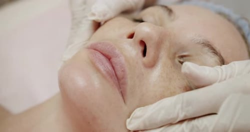 Closeup of Woman Client on Facial Massage at Spa Salon Skincare Concept