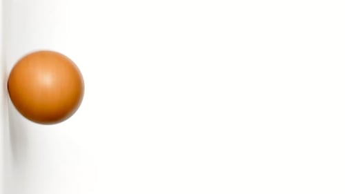 Rotating Light Brown Egg on White Background