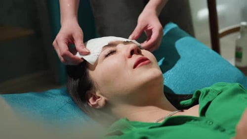 Professional Skincare Expert Performs Precise Facial Cleansing Routine Bright Clinic Setting with