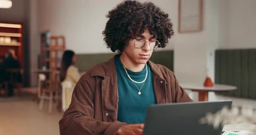 Education, typing and man with laptop in coffee shop, reading digital notes