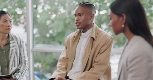 Adults in Discussion Group Meeting Indoors