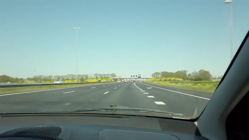 Traffic scene view on the highway from the passenger seat in the car.