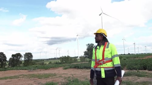 Wind Turbine Engineer Afro Engineer Maintains and Controls Wind Turbine Energy Generation on field