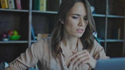 Worried Business Woman Face Looking at Laptop in Office. Close Up Of