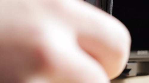 Close up, person's hand opening camera port cover connecting micro usb to charge DSLR