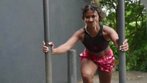 Determined Female Athlete Performs Intense Sled Push Workout Outdoors Muscles Flex As Biethnic Woman