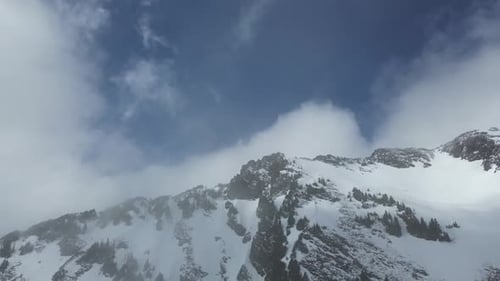 Snowy Mountain Peak. Blue sky and clouds. British Columbia, Canada.