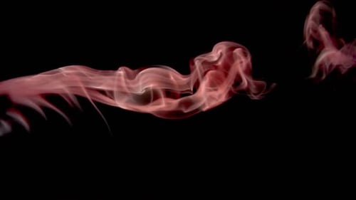 Red Smoke Flowing Across Black Background