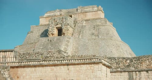 Ancient pyramid structure Mayan ruins under blue sky during a travel exploration