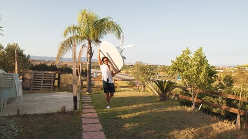 A Man Carrying A Plastic Table To Prepare For Lunch