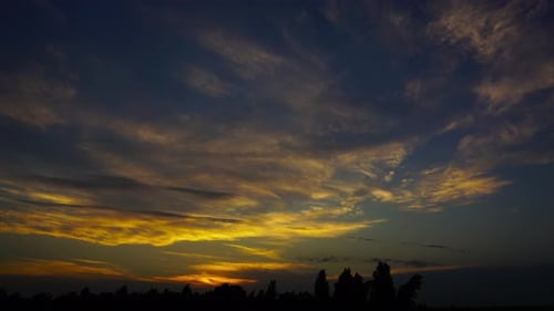Time Lapse of Golden Sunset Clouds
