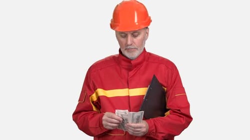 Old Construction Worker in Red Uniform Counts Money