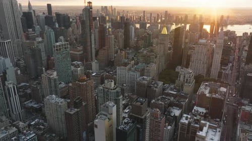 Aerial Views Capture the Sun Setting Over Midtown Manhattan Skyline Showcasing the Stunning Beauty