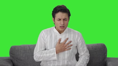 Indian man having a Asthma attack Green screen