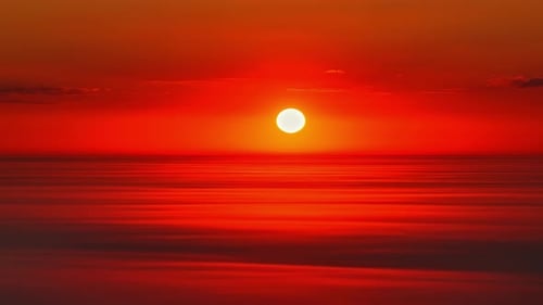 Sunset with Red Sun Over Hazy Sky and Clean Gradient