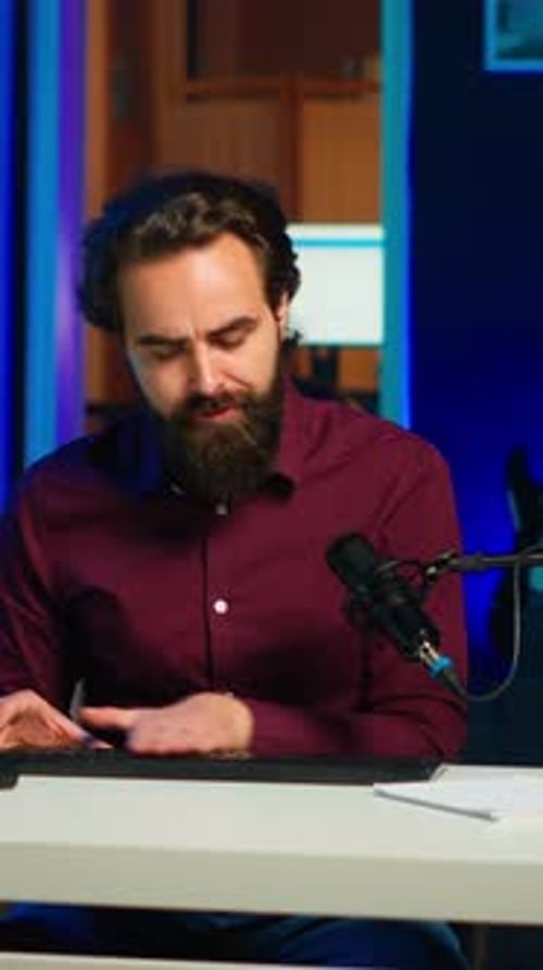 Vertical Video Man Filming Video for Online Channel Presenting Mouse and Keyboard