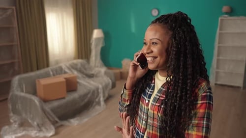 Woman Talking on Phone in New Home
