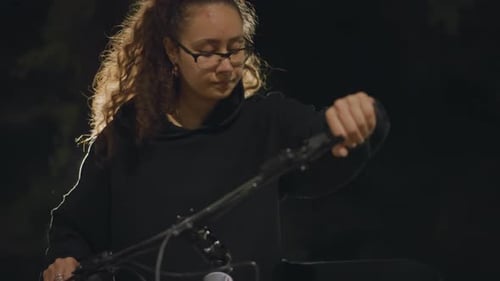 Urban Cyclist With Glowing Backdrop Woman On Bike Under Illuminated City Night Serene Nighttime