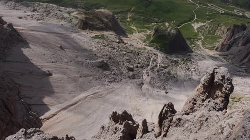 Steep Rocky Slopes and Alpine Valleys Captured from a High Mountain Peak