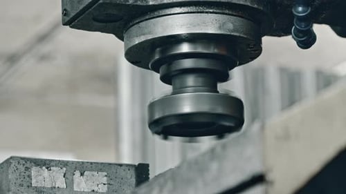 Metal cutting process in factory setting with industrial milling machine