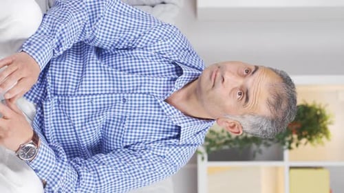 Vertical video of Suspicious man thinks.