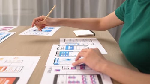 UX UI designer of startup company in workplace plan on user interface. Synergic