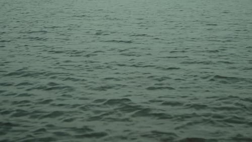 Calm ocean water with gentle ripples in a peaceful, serene setting