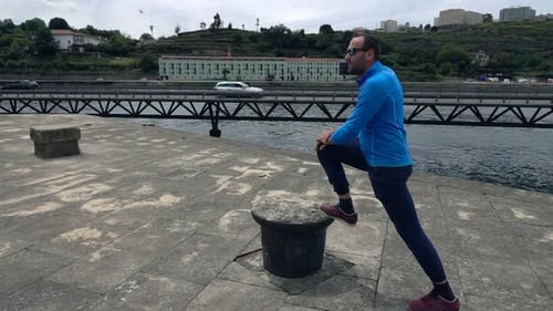 Young Man Stretching Leg in City Near Bridge, Super 240