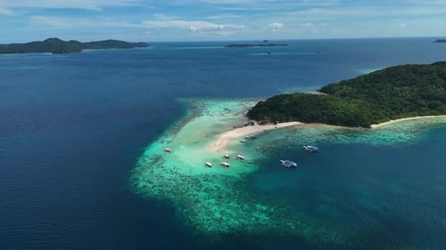 Stunning drone shot of Bulog Dos Island, with its clear blue waters and tropical island beauty.