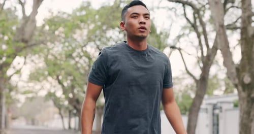 Man Warming Up and Stretching Before Exercising Outdoors