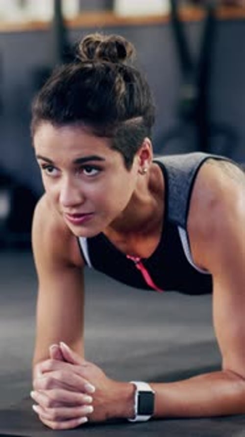 Thinking, woman and plank for fitness in gym for exercise, core strength and balance bodyweight