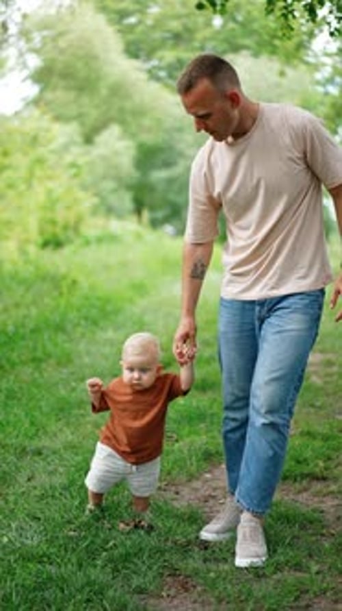 Father and Child Walking Together in Nature